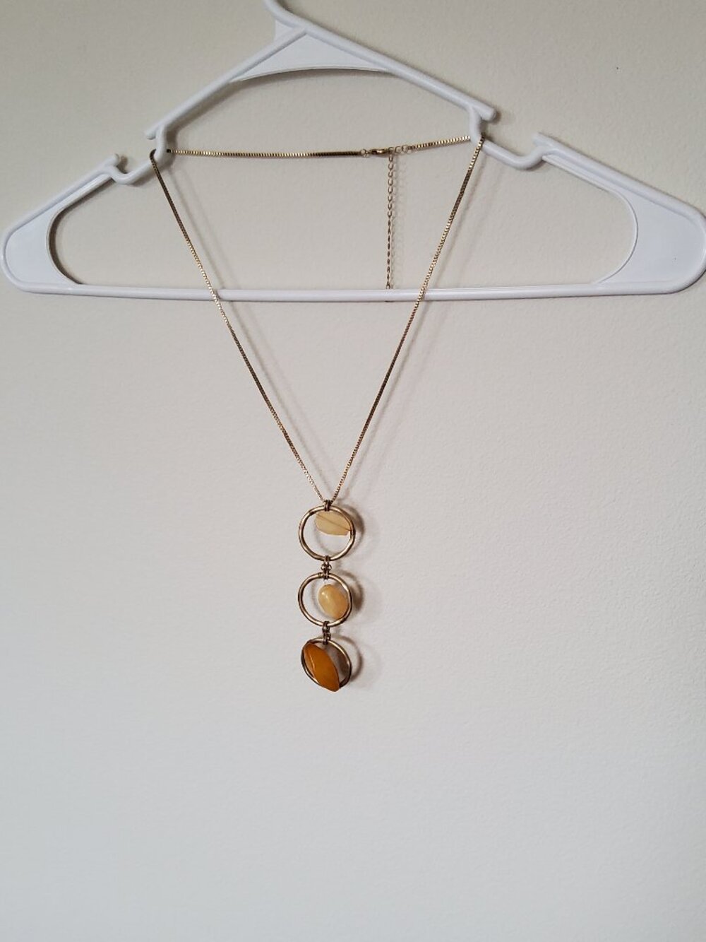 Gold toned necklace with 3 tiered circles